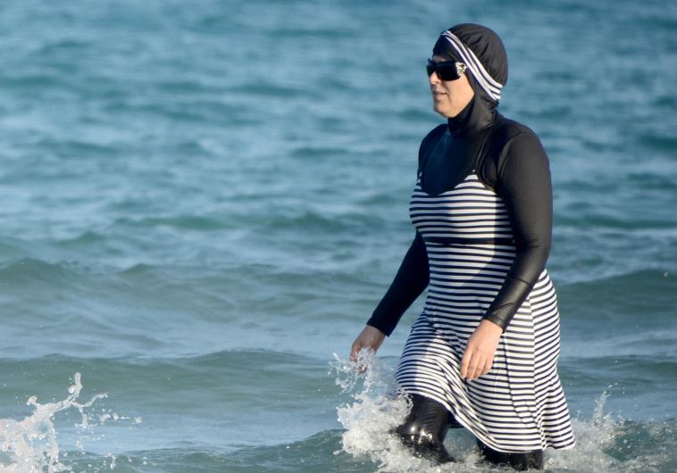 Tunisian women wearing a "burkini Tunisian women wearing a "burkini