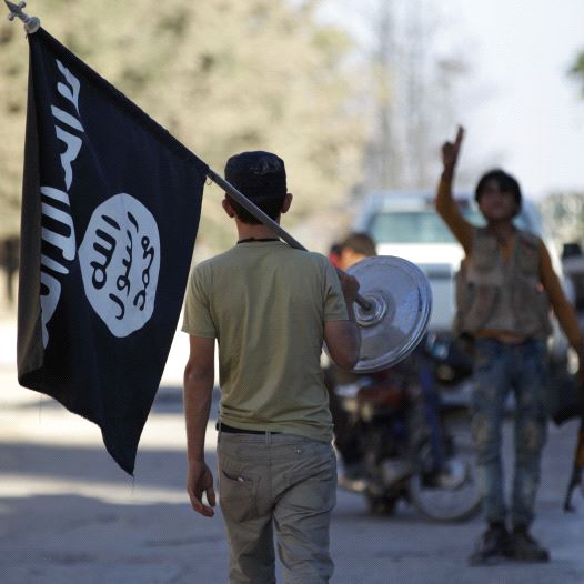 A rebel fighter takes away a flag that belonged to Islamic State militants in Akhtarin village, after rebel fighters advanced in the area, in northern Aleppo Governorate, Syria, October 7, 2016 A rebel fighter takes away a flag that belonged to Islamic State militants in Akhtarin village, after rebel fighters advanced in the area, in northern Aleppo Governorate, Syria, October 7, 2016