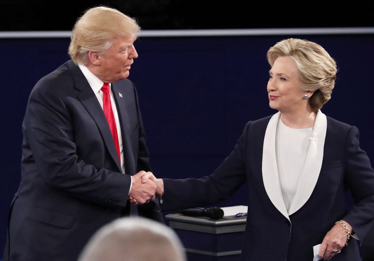 Republican US presidential nominee Donald Trump and Democratic U.S. presidential nominee Hillary Clinton shake hands at the conclusion of their presidential town hall debate at Washington University in St. Louis, Missouri, US, October 9, 2016 Republican US presidential nominee Donald Trump and Democratic U.S. presidential nominee Hillary Clinton shake hands at the conclusion of their presidential town hall debate at Washington University in St. Louis, Missouri, US, October 9, 2016